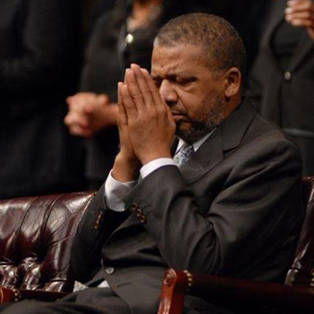 Bishop Dwight Pate in Prayer
